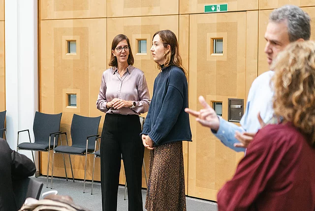 two participants talking to each other during a break
