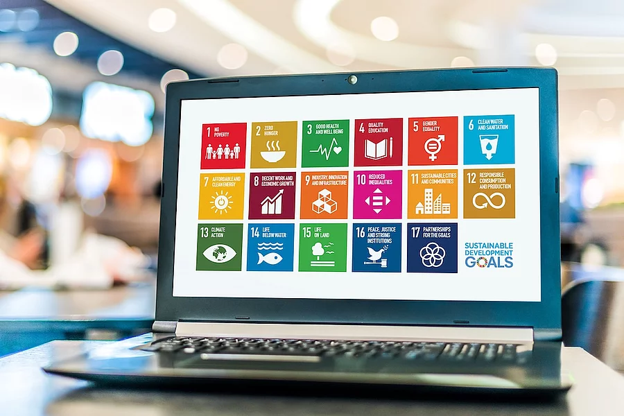 Laptop displaying logo of The Sustainable Development Goals 
